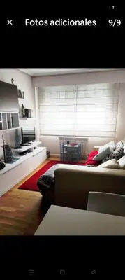 a living room with a couch and a window at Precioso piso en Ribadavia in Ribadavia