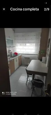 a kitchen with a table and a sink and a table at Precioso piso en Ribadavia in Ribadavia