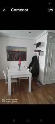 a white table and chairs in a room at Precioso piso en Ribadavia in Ribadavia