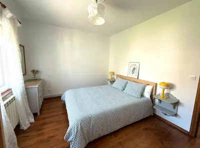 a bedroom with a bed in a white room at Apartamento a Un Paso de la Playa de Tapia in Tapia de Casariego
