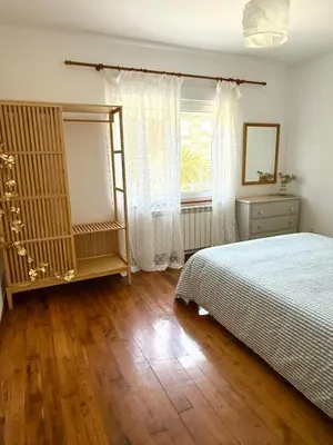 a bedroom with a bed and a window at Apartamento a Un Paso de la Playa de Tapia in Tapia de Casariego