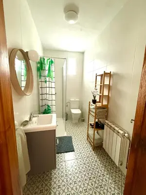 a bathroom with a sink and a toilet at Apartamento a Un Paso de la Playa de Tapia in Tapia de Casariego