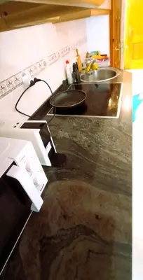 a kitchen counter top with a sink and a sink at EnFOZ 1ª Línea de Playa II in Foz