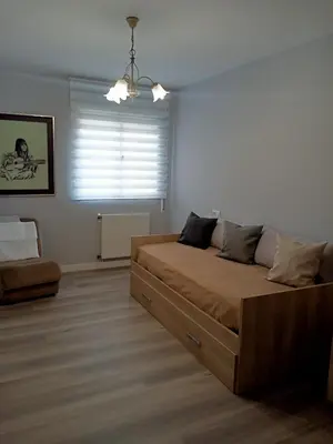 a bedroom with a large bed and a window at Luz de Guía in Burela de Cabo