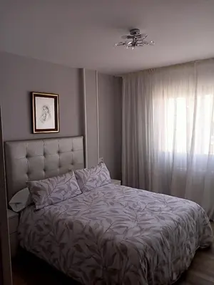 a bedroom with a bed and a window at Luz de Guía in Burela de Cabo