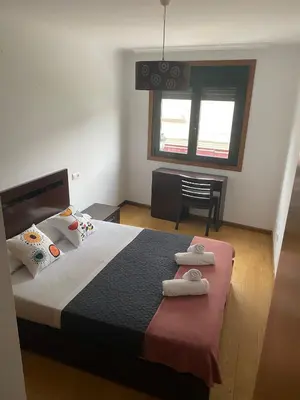 a bedroom with a bed with two towels on it at Terra 1B in Caldas de Reis