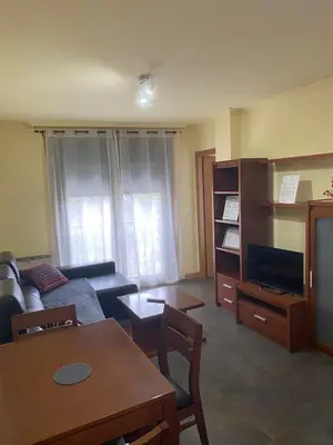 a living room with a couch and a table at Terra 1B in Caldas de Reis