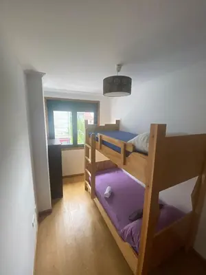a room with two bunk beds and a window at Terra 1B in Caldas de Reis