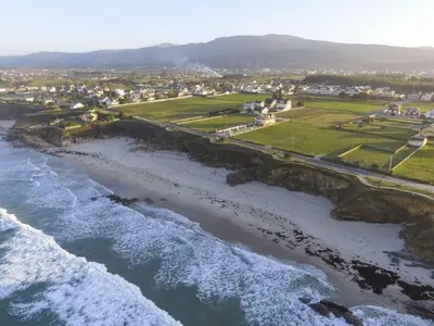 an aerial view of the shoreline of a beach at Costa SPA Piscinas de lujo - Playa las Catedrales in Barreiros