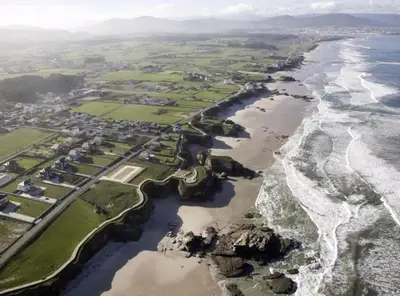 an aerial view of the shoreline of the ocean at Costa SPA Piscinas de lujo - Playa las Catedrales in Barreiros