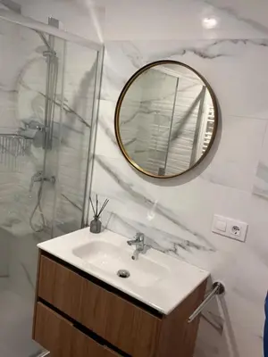 a bathroom with a sink and a mirror at Sleep Padrón in Padrón
