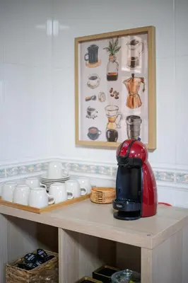 a coffee maker on a shelf in a kitchen at Casa Rural Antonio de Sofia in César