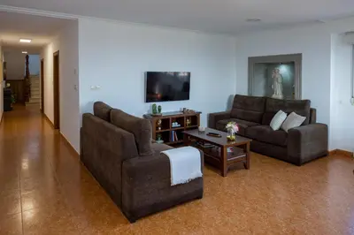a living room with two couches and a coffee table at Casa Rural Antonio de Sofia in César