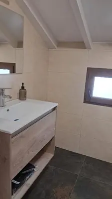 a bathroom with a sink and a window at Casa Loma Manolo in Molinaseca