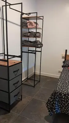 a room with a rack with clothes on it at Casa Loma Manolo in Molinaseca