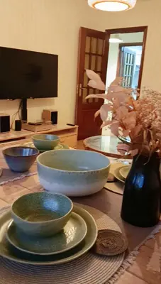 a living room with a couch and a table at Casa Buen Camino in Arzúa
