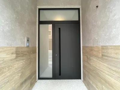 a black door with a mirror in a room at As Tres Praias in Burela de Cabo