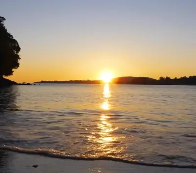a sunset over a body of water at Adiva Casa Da Avoa in Puentedeume