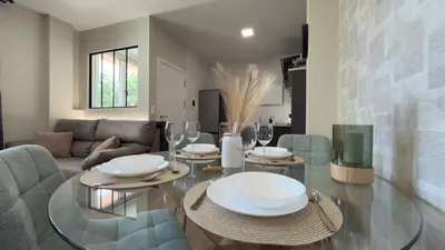 a living room with a glass table and chairs at Carude 76 in Monforte de Lemos