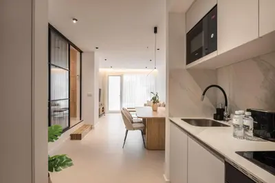 a kitchen with a table and a dining room at Loft América 41 B in Melide