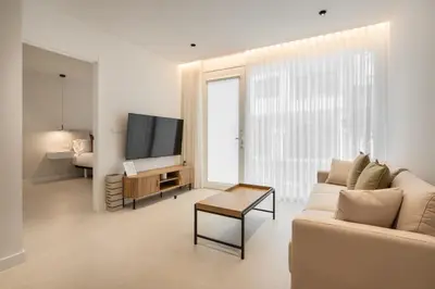 a living room with a couch and a tv at Loft América 41 B in Melide