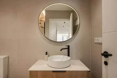 a bathroom with a sink and a mirror at Loft América 41 B in Melide