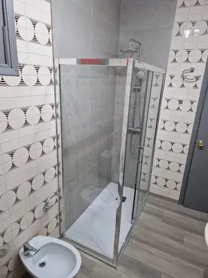 a bathroom with a sink and a toilet at Vivienda Turística Mou in Arzúa