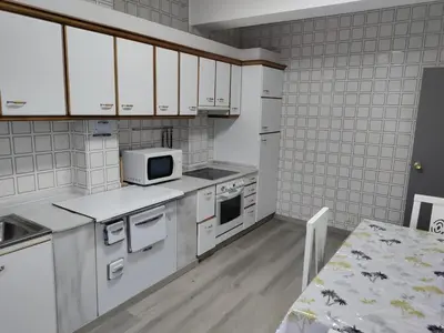 a bathroom with a toilet and a sink at Vivienda Turística Mou in Arzúa