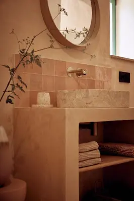 a bathroom with a sink and a mirror and towels at Casa Albaredo, Aldea Rural, Boutique Hotel, Retreat, in O Cebreiro