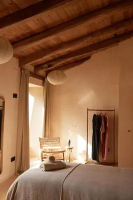 a bedroom with a bed and a wooden ceiling at Casa Albaredo, Aldea Rural, Boutique Hotel, Retreat, in O Cebreiro