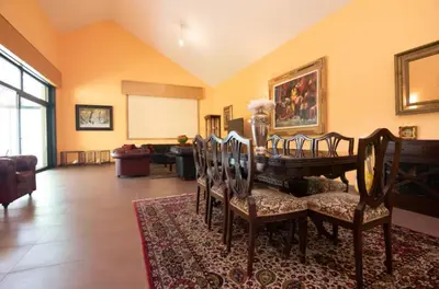 a living room with a table and chairs at Gavian House in A Coruña