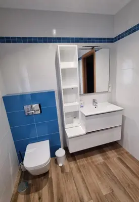a bathroom with a toilet and a sink and a mirror at A Casa de Chefa in San Ciprián