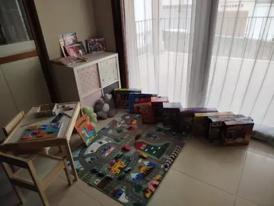 a childs play area with toys on the floor at A Casa de Chefa in San Ciprián