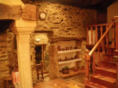 a room with a staircase and a stone wall at Casa Torres in Cruces