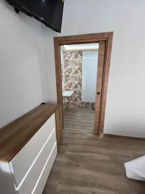 a room with a door and a mirror at AMC Boente in Arzúa