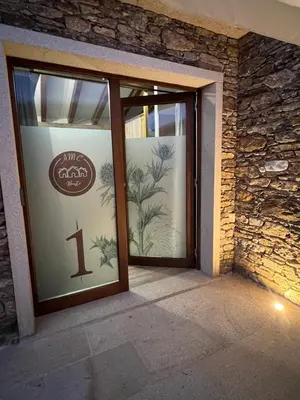 a glass door with a sign on it at AMC Boente in Arzúa