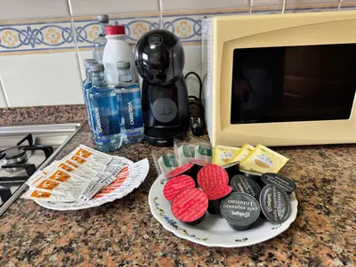a counter with two plates of food and a microwave at Apartamento Arnela Foz in Foz