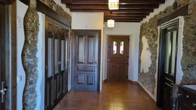 a hallway with a door in a house at Casa Peruxo in Ribadeo