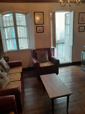 a living room with a couch and a coffee table at casa en casco histórico in Allariz