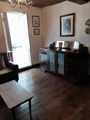 a living room with a couch and a table at casa en casco histórico in Allariz