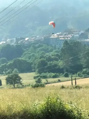 a red kite flying in the sky over a field at alma de quireza in Santo Tomé