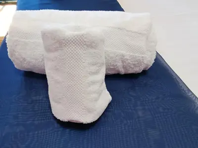 a pair of white socks sitting on top of a bed at alma de quireza in Santo Tomé