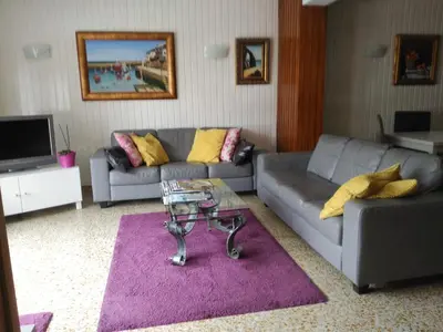 a living room with a couch and a table at Hotel Puente de los Santos in Tapia de Casariego