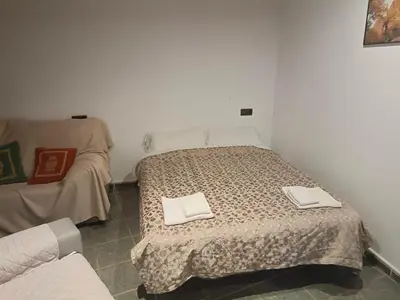 a bedroom with a bed with two towels on it at casa rural San Vicente Borrenes in Borrenes