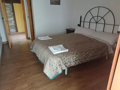 a bedroom with a bed with a tray on it at casa rural San Vicente Borrenes in Borrenes