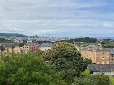 a view of a city with houses and trees at Piso Mirador de San Cosme in San Cosme de Barreiros