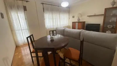 a living room with a couch and a table at Piso Mirador de San Cosme in San Cosme de Barreiros