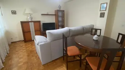 a living room with a couch and a table at Piso Mirador de San Cosme in San Cosme de Barreiros
