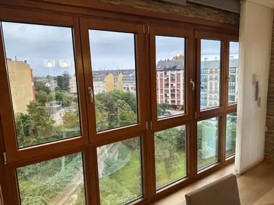 a room with four windows with a view of a city at #Las Azaleas# in Teijois