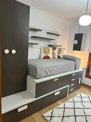 a bedroom with a bed with a built in cabinet at #Las Azaleas# in Teijois
